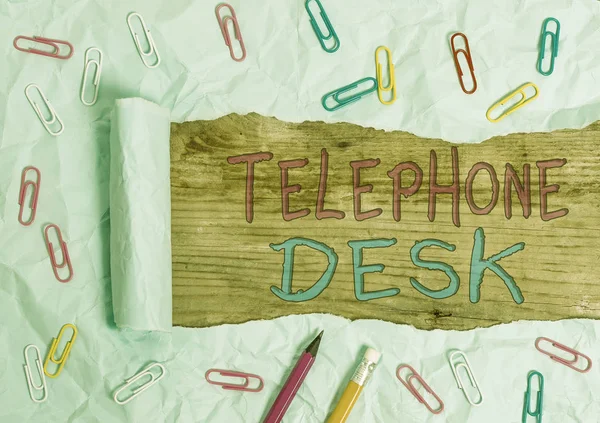 Text sign showing Telephone Desk. Conceptual photo provide a working surface enough to write notes while calling Stationary and torn cardboard placed above a wooden classic table backdrop.