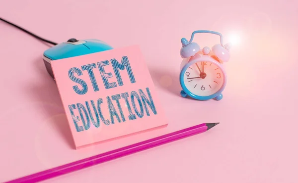 Word writing text Stem Education. Business concept for develop to prepare primary and secondary students for college Vintage alarm clock wire mouse empty notepad markers colored background.