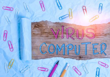 Text sign showing Virus Computer. Conceptual photo Malicious software program loaded onto a user s is computer Stationary and torn cardboard placed above a wooden classic table backdrop.
