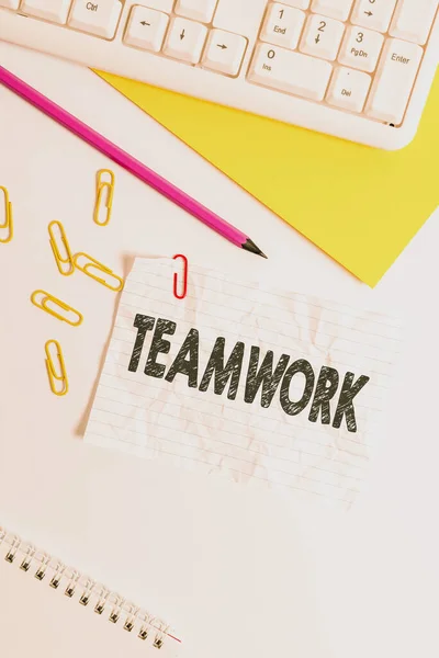 Word writing text Teamwork. Business concept for combined action of group especially when effective and efficient Flat lay above white blank paper with copy space for text messages. — 스톡 사진