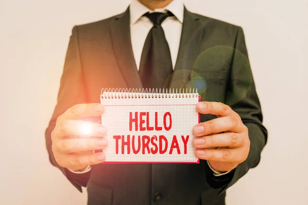 Text sign showing Hello Thursday. Conceptual photo the greeting used to welcome the day after wednesday Male human wear formal work suit office look hold mathematics book use hand. — Stockfoto