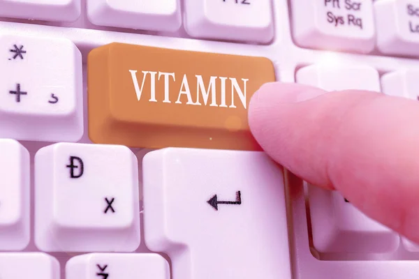 Kézírás szöveg írás Vitamin. A normális növekedéshez elengedhetetlen szerves vegyületek fogalom szerinti csoportja. — Stock Fotó