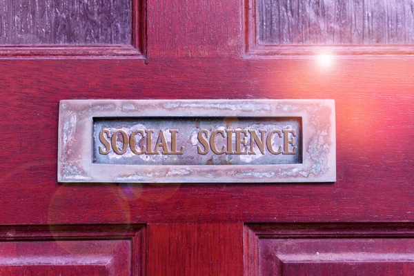 Handwriting text writing Social Science. Concept meaning scientific study of huanalysis society and social relationships Old retro mailbox on the wooden doors. Hole on the wooden doors for mail. — Stock Fotó