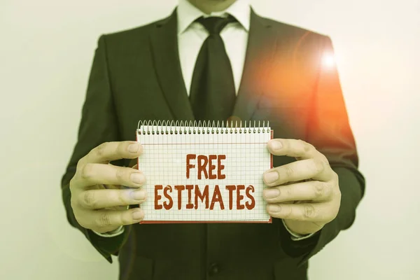 Text sign showing Free Estimates. Conceptual photo assess an approximate calculation or judgment of the value Male human wear formal work suit office look hold mathematics book use hand.