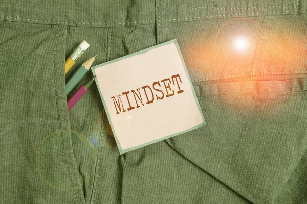 Handwriting text writing Mindset. Concept meaning the mental and emotional attitude that focuses on bright side Writing equipment and pink note paper inside pocket of man work trousers. — Stock Photo, Image