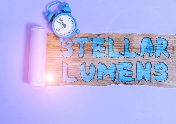 Text sign showing Stellar Lumens. Conceptual photo cryptocurrency platform that uses on remittance and payments Alarm clock and torn cardboard placed above a wooden classic table backdrop. — Stock Fotó