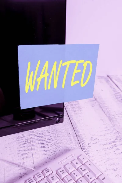 Handwriting text writing Wanted. Concept meaning Desire something Wish want Hoping for Somebody being searched Notation paper taped to black computer monitor screen near white keyboard. — 图库照片