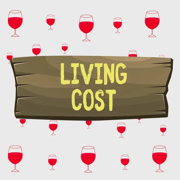 Text sign showing Living Cost. Conceptual photo the amount of money that a demonstrating needs to sustain life Plank wooden board blank rectangle shaped wood attached color background. — Stok fotoğraf