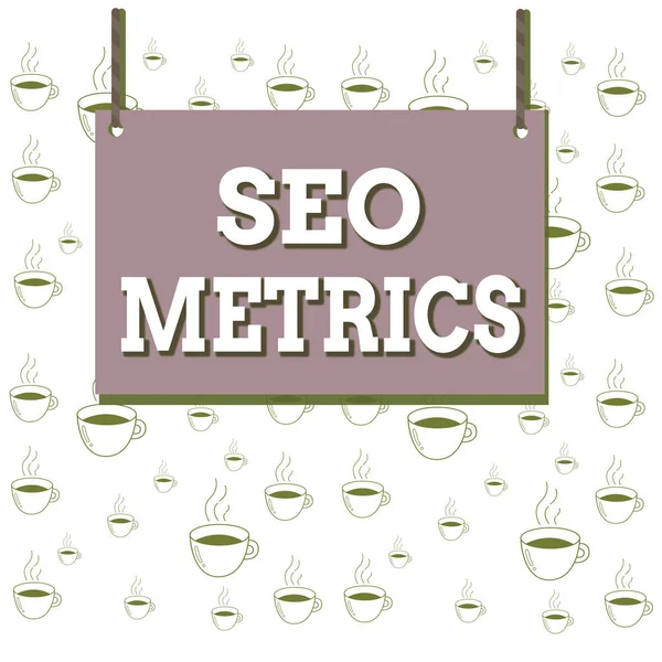 Writing note showing Seo Metrics. Business photo showcasing measure the perforanalysisce of website for organic search results Wooden board wood empty frame fixed colorful striped string. — 图库照片