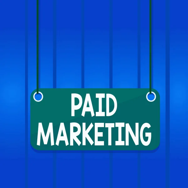 Writing note showing Paid Marketing. Business photo showcasing marketers pay the owner of ad space in use of that space Board color background plank attached string panel rectangle. — Zdjęcie stockowe