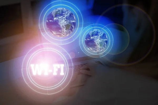 Word writing text Wi Fi. Business concept for radio technologies commonly used for wireless local area networking Elements of this image furnished by NASA. — Stok fotoğraf