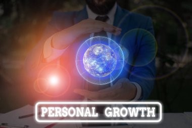 Conceptual hand writing showing Personal Growth. Business photo text ongoing process of understanding and developing oneself Elements of this image furnished by NASA.