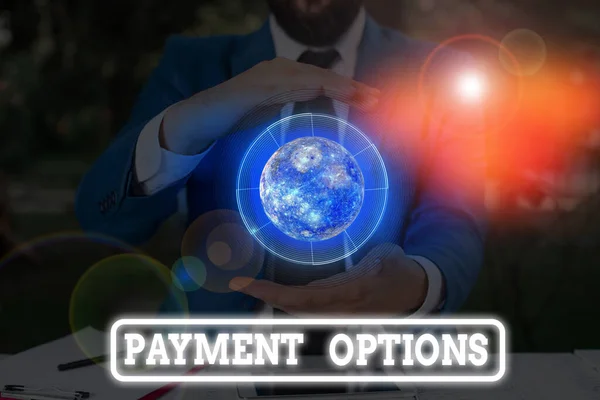 Conceptual hand writing showing Payment Options. Business photo text ways that a customers can pay for the goods and services Elements of this image furnished by NASA. — Stock fotografie