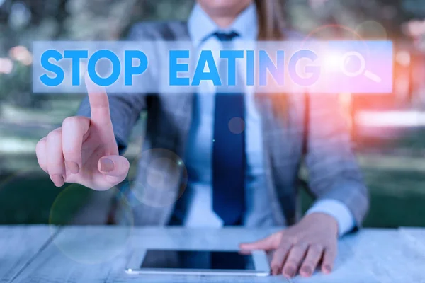 Text sign showing Stop Eating. Conceptual photo cease the activity of putting or taking food into the mouth.