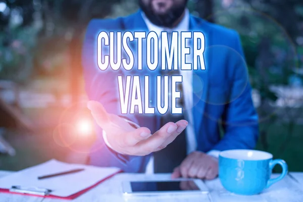 Word writing text Customer Value. Business concept for level of satisfaction of your customer towards your business Man with opened hands in fron of the table. Mobile phone and notes on the table.
