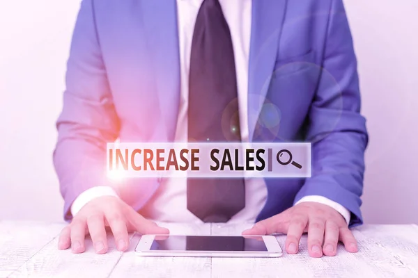 Text sign showing Increase Sales. Conceptual photo a high number of customers completed the sales cycle Businessman in blue suite with a tie holds lap top in hands. — Stock Photo, Image