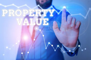 Özellik Değerini gösteren not yazılıyor. İş fotoğrafı sergisi, verilen bir mülkün piyasa değerine atıfta bulunur.