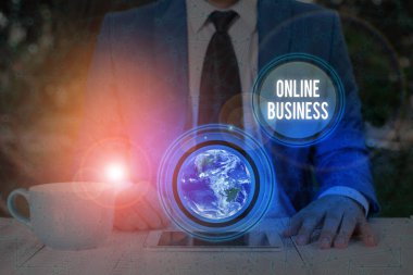 Handwriting text writing Online Business. Concept meaning kind of business activity that happens over the internet Elements of this image furnished by NASA.