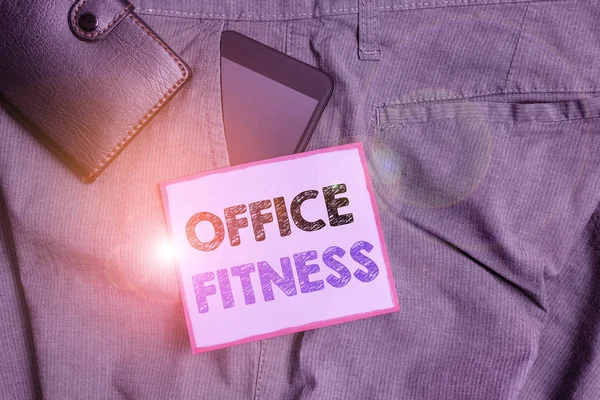 Handwriting text Office Fitness. Concept meaning Encouraging fitness and balance lifestyle in the workplace Smartphone device inside trousers front pocket with wallet and note paper.