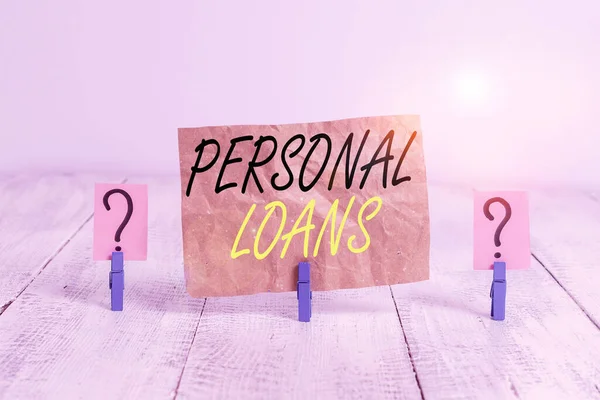 Word writing text Personal Loans. Business concept for unsecured loan and helps you meet your financial needs Scribbled and crumbling sheet with paper clips placed on the wooden table.