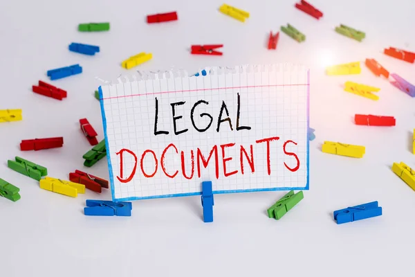 Text sign showing Legal Documents. Conceptual photo a document concerning a legal matter Drawn up by a lawyer Colored clothespin papers empty reminder white floor background office. — Stockfoto