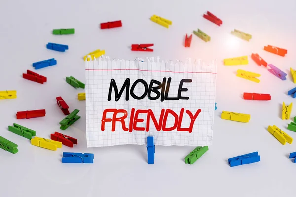 Conceptual hand writing showing Mobile Friendly. Business photo showcasing website is designed to display on a mobile device correctly Colored clothespin papers empty reminder white floor office. — Stock Photo, Image