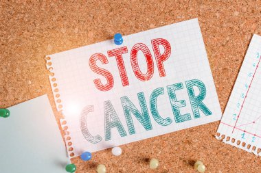 Conceptual hand writing showing Stop Cancer. Business photo text prevent the uncontrolled growth of abnormal cells in the body Corkboard size paper thumbtack sheet billboard notice board.