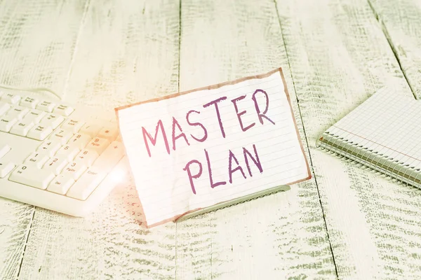 Conceptual hand writing showing Master Plan. Business photo showcasing dynamic longterm planning document Comprehensive plan of action Notepaper on wire in between computer keyboard and sheets. — Stock fotografie