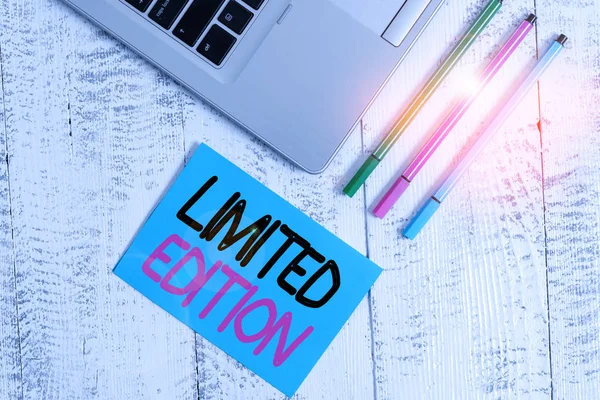 Handwriting text writing Limited Edition. Concept meaning produced in small numbers so will be valuable in the future Trendy metallic laptop blank sticky pad three pens lying vintage table. — Stockfoto