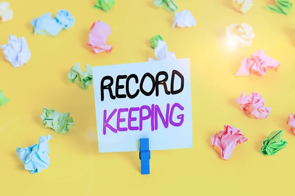 Writing note showing Record Keeping. Business photo showcasing The activity or occupation of keeping records or accounts Colored crumpled paper empty reminder white floor clothespin. — Stock Fotó