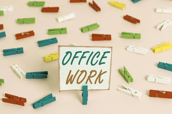 Conceptual hand writing showing Office Work. Business photo showcasing any clerical or administrative work for an organization Colored clothespin papers empty reminder pink floor office. — Stockfoto