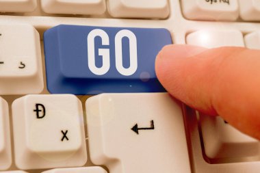 Word writing text Go. Business concept for to move or travel somewhere in order to do something Leave or depart.
