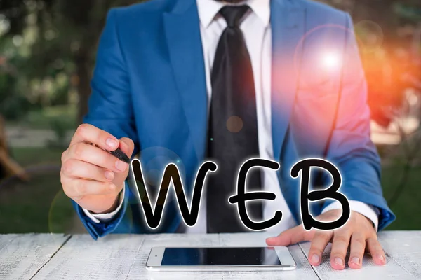 Handwriting text writing Web. Concept meaning a system of Internet servers that support specially formatted documents Businessman holds pen and points into copy space. — Stock Photo, Image