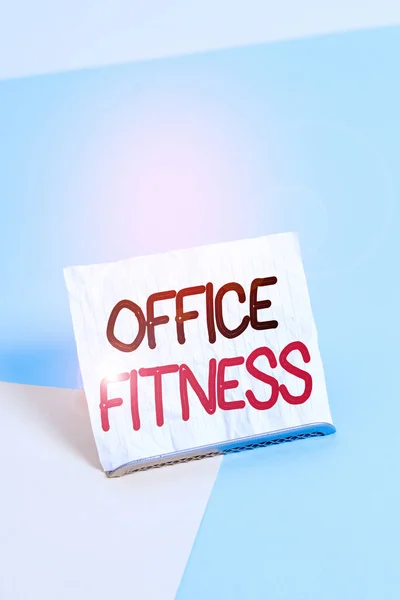 Writing note showing Office Fitness. Business photo showcasing Encouraging fitness and balance lifestyle in the workplace Paper on buffer wire on soft pastel multi colours backdrop.