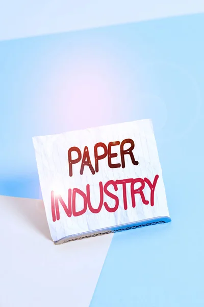 Writing note showing Paper Industry. Business photo showcasing industry of analysisufacturing and selling cellulosebased product Paper on buffer wire on soft pastel multi colours backdrop.