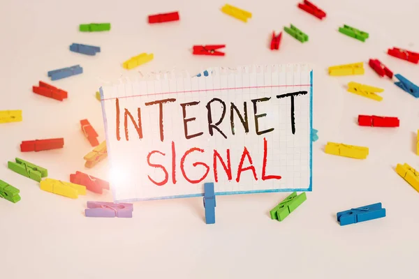 Text sign showing Internet Signal. Conceptual photo signal strength received by a phone from a cellular network Colored clothespin papers empty reminder white floor background office.