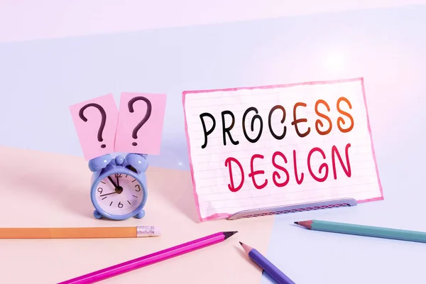 Text sign showing Process Design. Conceptual photo process of originating and developing a plan for a product Mini size alarm clock beside stationary placed tilted on pastel backdrop.