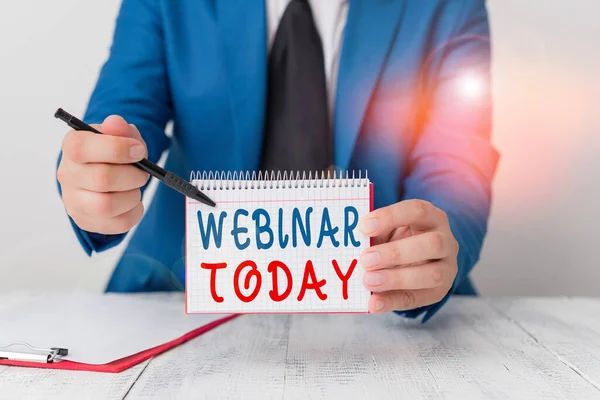 Text sign showing Webinar Today. Conceptual photo seminar or other presentation that takes place on the Internet Man holds empty paper with copy space in front of him Copy Space. — Stock Photo, Image