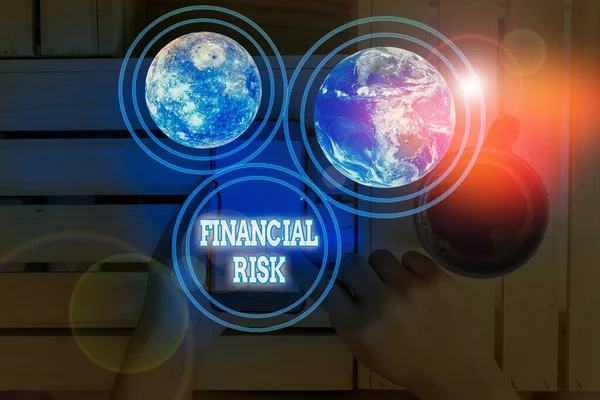 Conceptual hand writing showing Financial Risk. Business photo showcasing any of various types of risk associated with financing Elements of this image furnished by NASA.