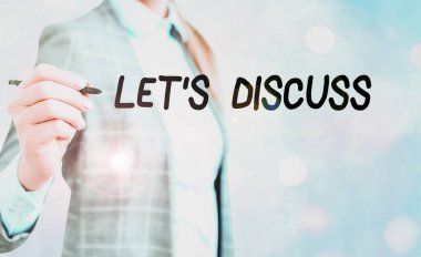 Kavramsal el yazısı Let Discuss 'u gösteriyor. İş fotoğrafı gösterimi, grup olarak çalışmak ya da beyin fırtınası yapmak anlamına gelir.