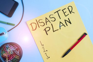 Word writing text Disaster Plan. Business concept for outlines how an organization responds to an unplanned event Cardboard and writing equipment with modern gadget above pastel backdrop.