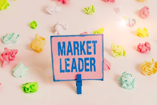 Text sign showing Market Leader. Conceptual photo company selling the largest quantity of a particular product Colored crumpled papers empty reminder white floor background clothespin. — 스톡 사진