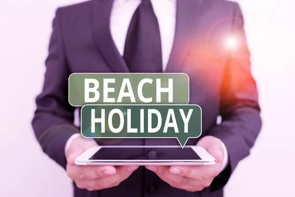 Conceptual hand writing showing Beach Holiday. Business photo showcasing Vacations in which one basically just sunbathes in the beach Male human wear formal work suit hold hitech smartphone. — ストック写真