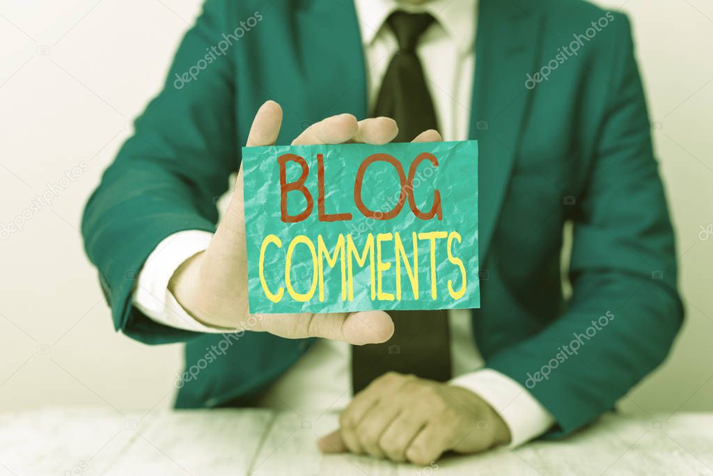 Writing note showing Blog Comments. Business photo showcasing Space at the end of each post for a reader to leave a comment Man holds empty paper with copy space in front of him Space.
