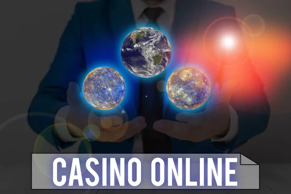 Word writing text Casino Online. Business concept for gamblers can play and wager on casino games through online Elements of this image furnished by NASA. — Stockfoto