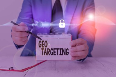 Writing note showing Geo Targeting. Business photo showcasing method of determining the geolocation of a website visitor.