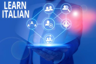 Writing note showing Learn Italian. Business photo showcasing gain or acquire knowledge of speaking and writing Italian.