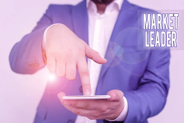 Handwriting text Market Leader. Concept meaning company selling the largest quantity of a particular product Businessman in the blue suite with lap top pointing with finger. — Stock Photo, Image