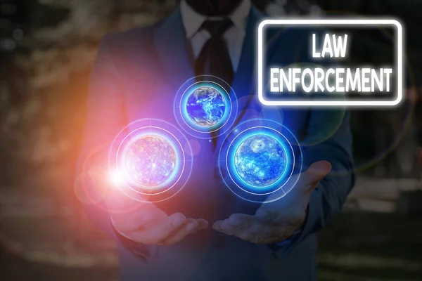 Handwriting text Law Enforcement. Concept meaning activity of making certain that the laws of an area are obey Elements of this image furnished by NASA. — Stock Photo, Image