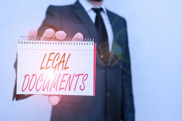 Text sign showing Legal Documents. Conceptual photo a document concerning a legal matter Drawn up by a lawyer Male human wear formal work suit office look hold mathematics book use hand. — Stock Photo, Image